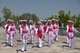 China: Bai women dancing at the Bai music and dance festival at San Ta Si (Three Pagodas), Dali, Yunnan